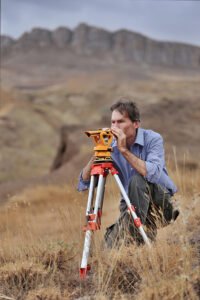 John Larsen surveying and laying out the pattern for the scans, with GPS readings included.