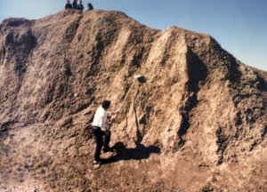 Dilaver using the shovel to shave a small amount from the matrix.
