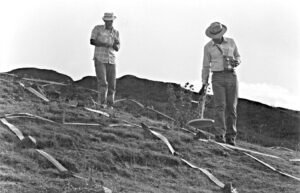 Ron Wyatt with Dr. John Baumgardner as Dr. Baumgardner uses Ron's metal detector to plot metal readings on the site