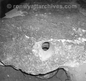 A drogue stone near the ark with no etchings on it. the mirror under the hole shows the hole goes all the way through.
