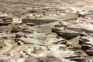 View of what looks to be a man-made structure, looking down from Masada (© Mary Nell Lee)